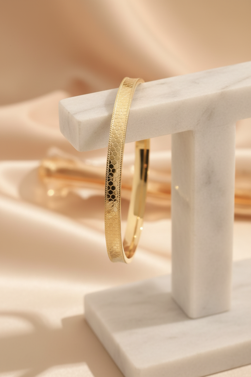 Gold bangle on stand