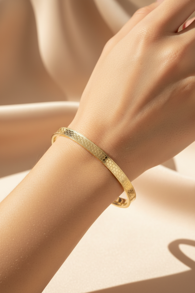 Gold bangle on wrist