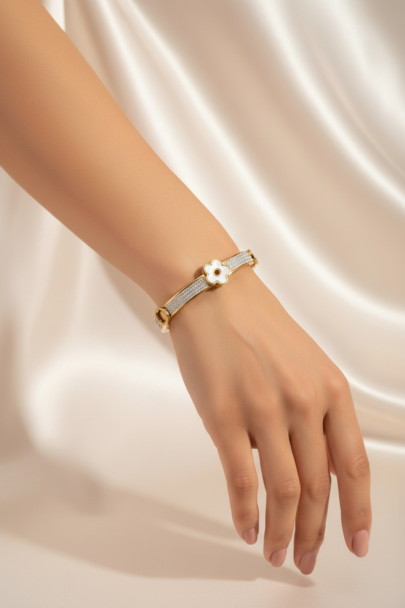 Gold pave clover bangle zoomed out on hand
