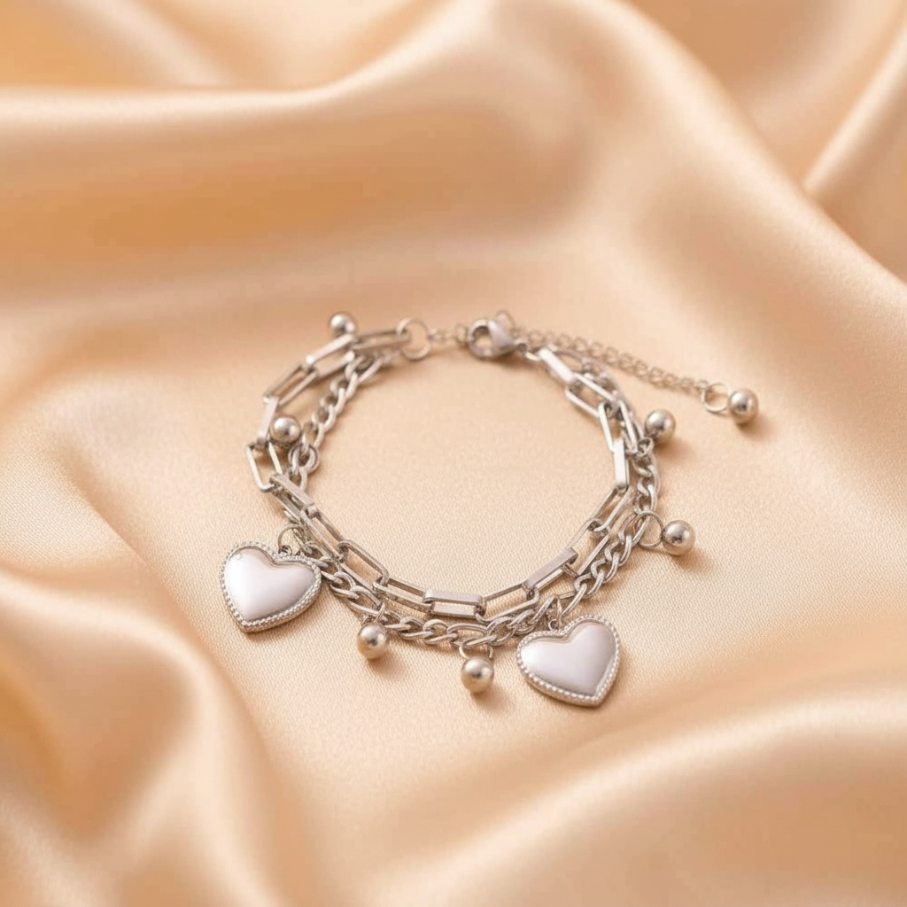 Silver heart bracelet on champagne satin
