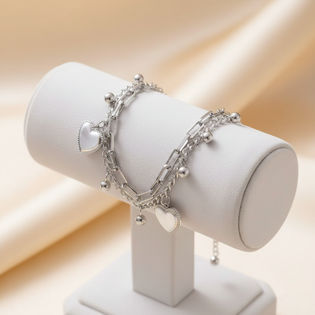 Silver heart bracelet on stand