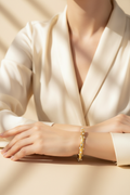 Woman wearing gold crystal cuff bangle